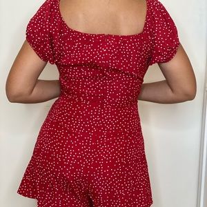 Red with white polka dots romper.